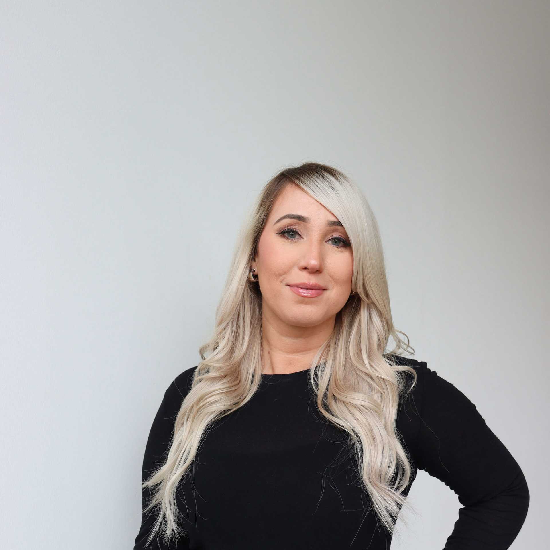 Portrait of Amy Harrietha, a professional stylist at Raven Hair Co., showcasing their expertise and style.