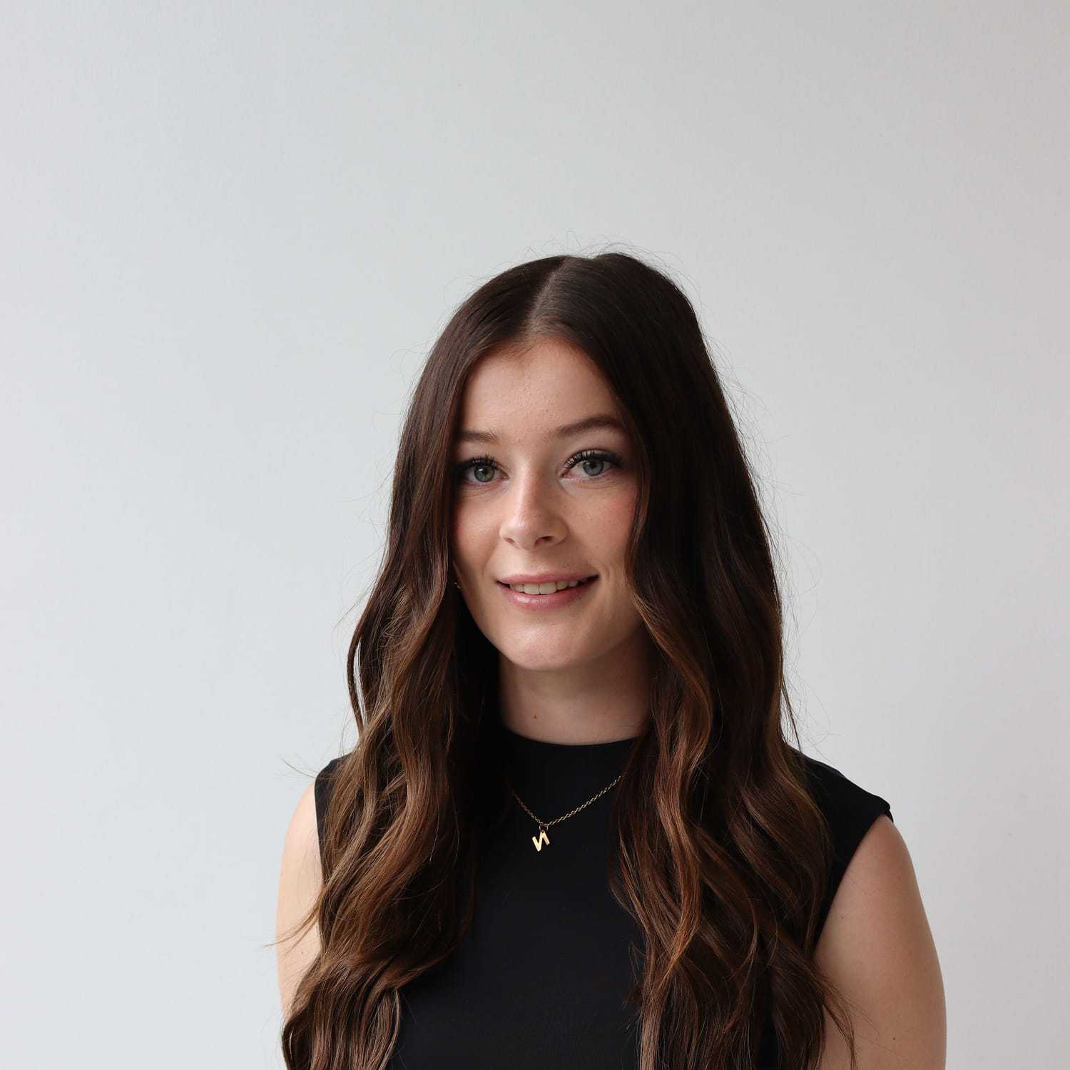 Portrait of Amy Cranley, a professional stylist at Raven Hair Co., showcasing their expertise and style.